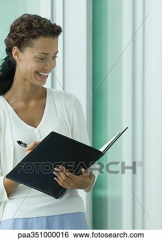 Woman writing in agenda View Large Photo Image Stock Photograph - Woman writing in agenda. Fotosearch