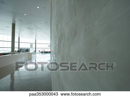 Airport concourse, concrete wall in foreground View Large Photo Image Stock Image - Airport concourse, concrete wall in foreground. Fotosearch