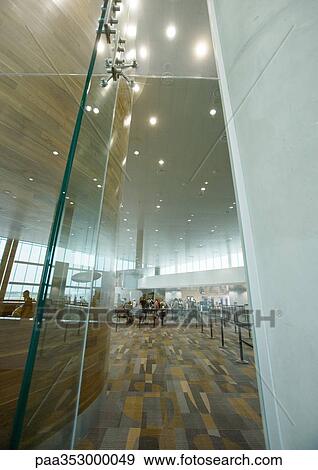 Airport interior, architectural view with security line in background View Large Photo Image Stock Photo - Airport interior, architectural view with security line in background. Fotosearch