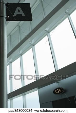 Airport interior: sign with letter "A" and boarding gate View Large Photo Image Picture - Airport interior: sign with letter "A" and boarding gate. Fotosearch