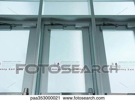 Emergency exit doors in airport, low angle view View Large Photo Image Stock Image - Emergency exit doors in airport, low angle view. Fotosearch