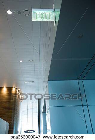 Exit sign in airport, low angle view View Large Photo Image Stock Photo - Exit sign in airport, low angle view. Fotosearch