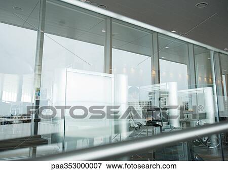 Telephones in airport, seen through glass wall View Large Photo Image Stock Photo - Telephones in airport, seen through glass wall. Fotosearch