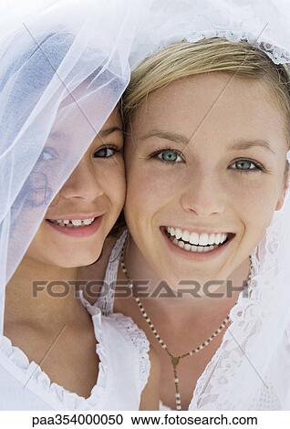 Stock Image - Bride and flower girl. Fotosearch