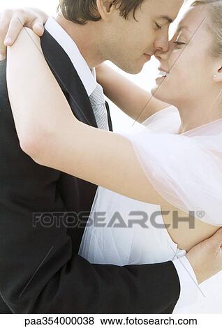 Bride and groom about to kiss, close-up View Large Photo Image Stock Photo - Bride and groom about to kiss, close-up. Fotosearch