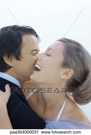 Bride and groom embracing, close-up View Large Photo Image Stock Photo - Bride and groom embracing, close-up. Fotosearch