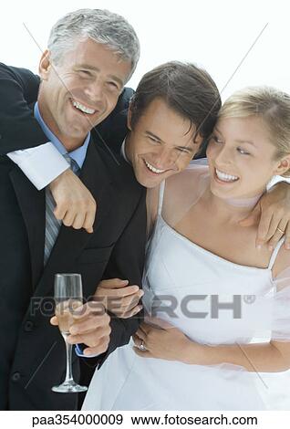Bride and groom with father, laughing View Large Photo Image Stock Photo - Bride and groom with father, laughing. Fotosearch