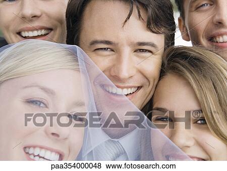 Bride and groom with friends, close-up of faces View Large Photo Image Stock Photo - Bride and groom with friends, close-up of faces. Fotosearch