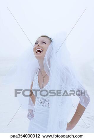 Bride laughing on beach View Large Photo Image Stock Image - Bride laughing on beach. Fotosearch