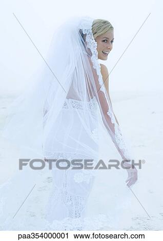 Stock Image - Bride looking over shoulder. Fotosearch