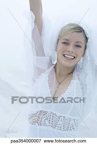 Stock Photo - Bride reaching into air. Fotosearch