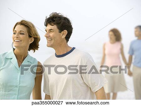 Stock Photo - Mature couple looking toward distance. Fotosearch