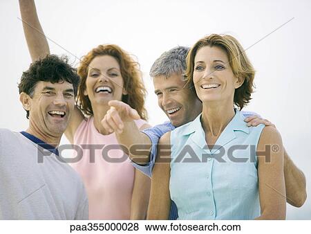 Two mature couples laughing View Large Photo Image Stock Photo - Two mature couples laughing. Fotosearch