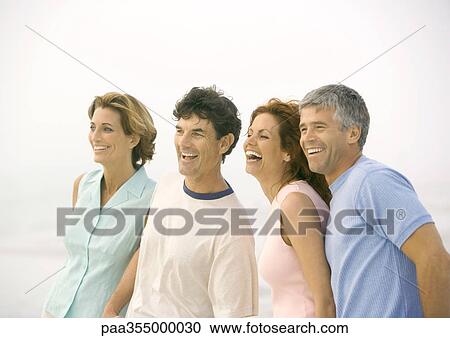 Two mature couples on beach View Large Photo Image Stock Image - Two mature couples on beach. Fotosearch