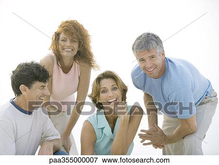 Two mature couples smiling View Large Photo Image Stock Photo - Two mature couples smiling. Fotosearch