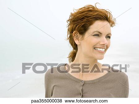 Stock Photo - Woman smiling, portrait. Fotosearch