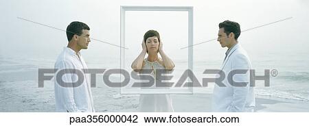 Woman standing behind frame, eyes shut and ears covered, between two men View Large Photo Image Stock Image - Woman standing behind frame, eyes shut and ears covered, between two men. Fotosearch