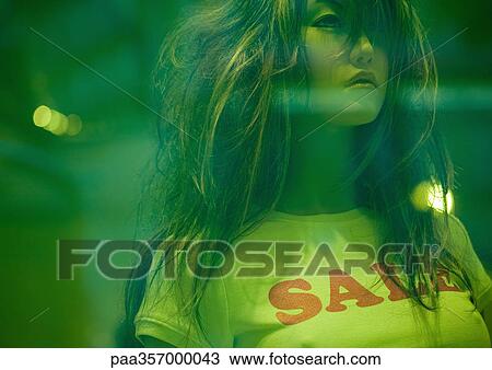 Mannequin in shop window wearing sale tee-shirt View Large Photo Image Stock Image - Mannequin in shop window wearing sale tee-shirt. Fotosearch