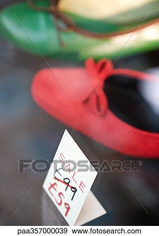 Sale price next to shoes View Large Photo Image Stock Photo - Sale price next to shoes. Fotosearch