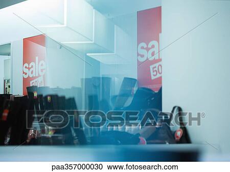 Shoe shop with sale signs View Large Photo Image Stock Image - Shoe shop with sale signs. Fotosearch