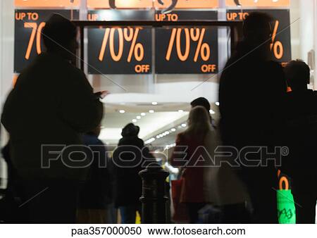 Shoppers waiting in front of store during sales View Large Photo Image Stock Image - Shoppers waiting in front of store during sales. Fotosearch