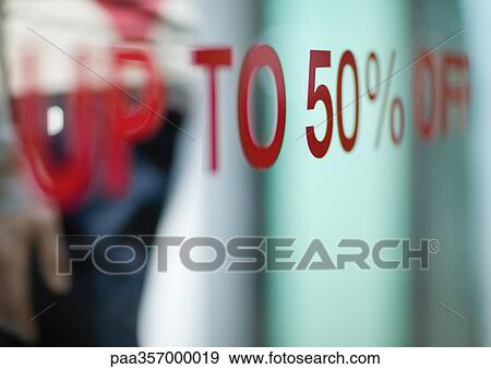 Up to 50% off text on shop window View Large Photo Image Stock Photo - Up to 50% off text on shop window. Fotosearch