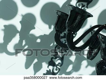 Chandelier and shadows on wall View Large Photo Image Stock Photo - Chandelier and shadows on wall. Fotosearch