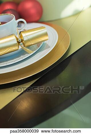 Cup and saucer with christmas cracker View Large Photo Image Stock Photo - Cup and saucer with christmas cracker. Fotosearch