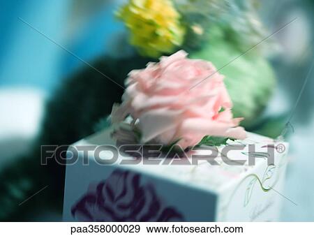 Stock Photo - Gift with rose on top. Fotosearch