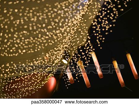 Strands of christmas lights and lanterns on building View Large Photo Image Stock Photo - Strands of christmas lights and lanterns on building. Fotosearch