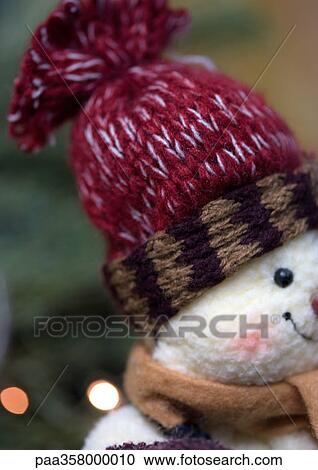 Stock Image - Stuffed snowman wearing hat. Fotosearch