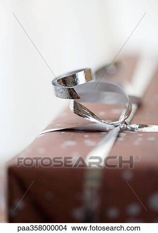 Wrapped gift View Large Photo Image Picture - Wrapped gift. Fotosearch