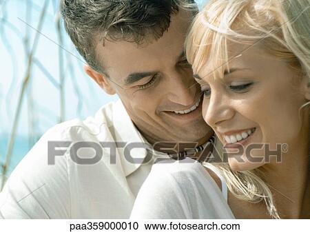 Couple smiling, close-up View Large Photo Image Stock Image - Couple smiling, close-up. Fotosearch