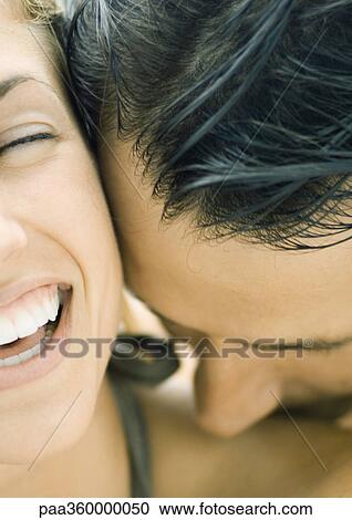 Man kissing woman's shoulder, woman laughing, close-up View Large Photo Image Stock Image - Man kissing woman's shoulder, woman laughing, close-up. Fotosearch