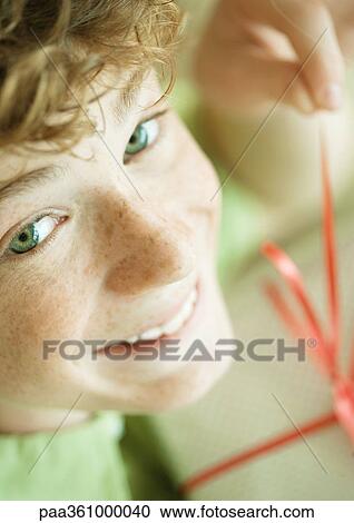 Boy with present, high angle view View Large Photo Image Stock Image - Boy with present, high angle view. Fotosearch