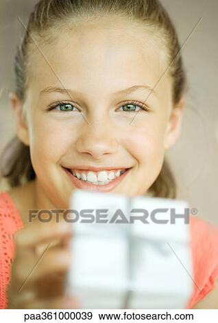 Girl with present View Large Photo Image Stock Photo - Girl with present. Fotosearch