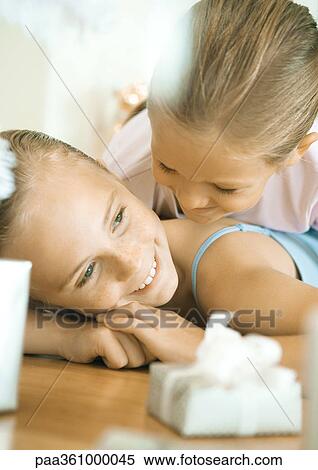 Two girls lying on floor near presents View Large Photo Image Stock Photography - Two girls lying on floor near presents. Fotosearch