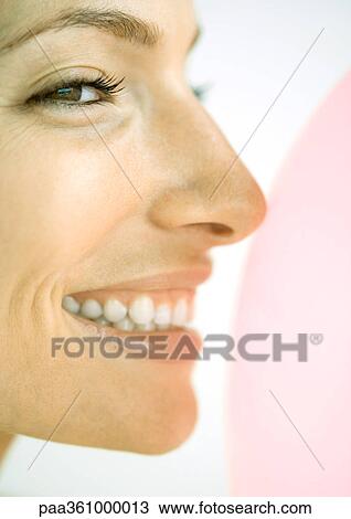 Woman smiling, close-up profile of face View Large Photo Image Stock Image - Woman smiling, close-up profile of face. Fotosearch