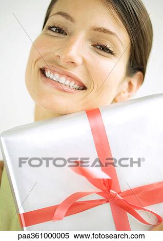 Woman with present, portrait View Large Photo Image Stock Photography - Woman with present, portrait. Fotosearch