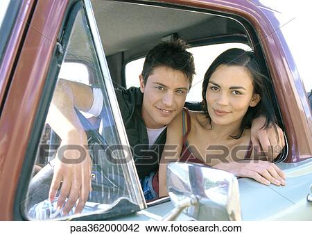 Young couple in pick-up truck View Large Photo Image Stock Image - Young couple in pick-up truck. Fotosearch