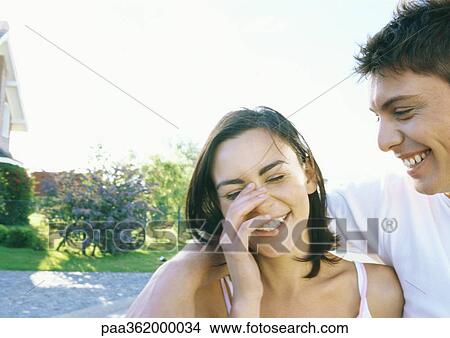 Young couple laughing View Large Photo Image Picture - Young couple laughing. Fotosearch