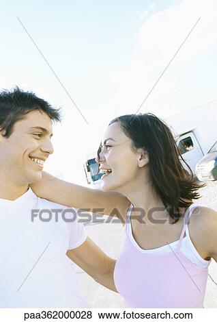 Stock Photo - Young couple laughing. Fotosearch