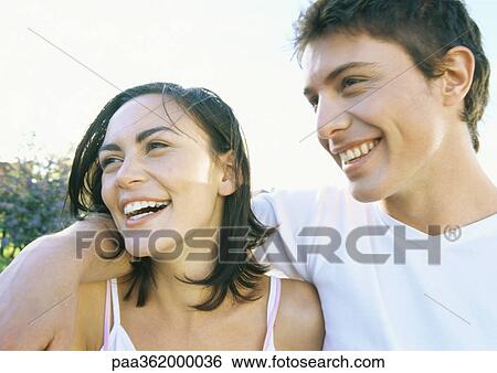 Young couple laughing View Large Photo Image Stock Photograph - Young couple laughing. Fotosearch