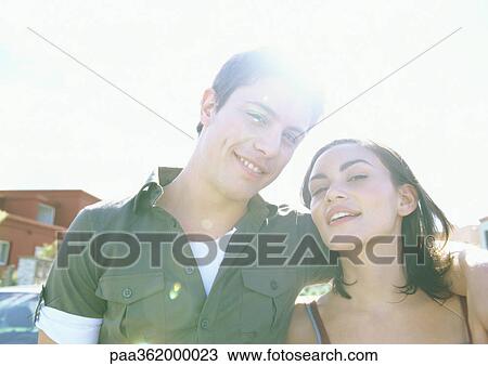 Young couple smiling View Large Photo Image Stock Image - Young couple smiling. Fotosearch