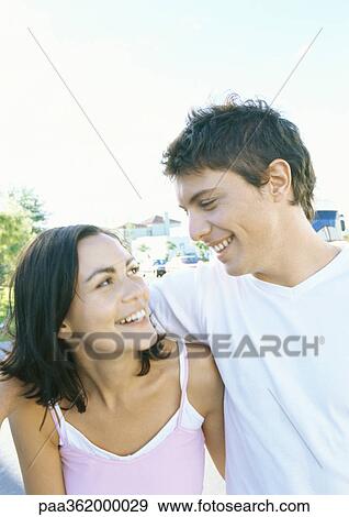 Young couple smiling View Large Photo Image Stock Photo - Young couple smiling. Fotosearch