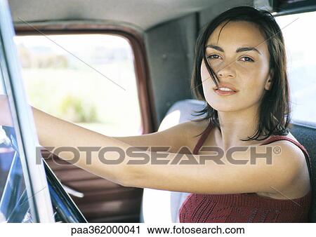 Young female driver View Large Photo Image Stock Image - Young female driver. Fotosearch