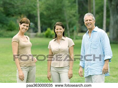 Three mature adults smiling View Large Photo Image Stock Photography - Three mature adults smiling. Fotosearch