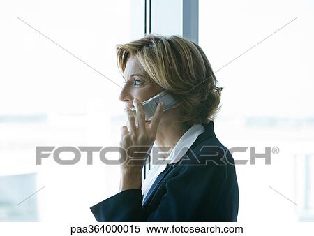Woman using cell phone View Large Photo Image Stock Photography - Woman using cell phone. Fotosearch