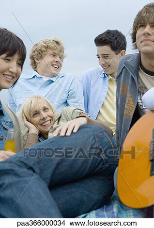 Picture - Group of young people hanging out together. Fotosearch