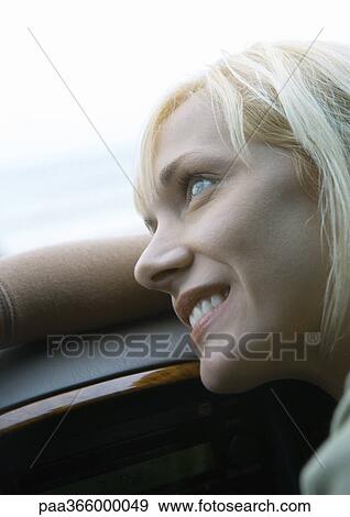 Woman leaning head on dashboard View Large Photo Image Stock Photo - Woman leaning head on dashboard. Fotosearch